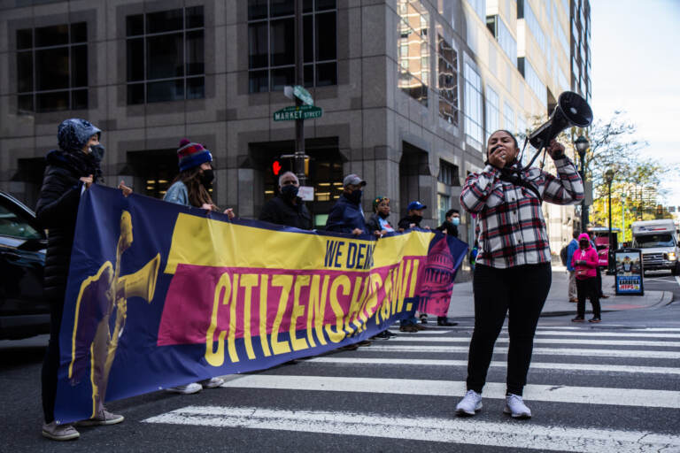 Maegan Llerena leads protesters at 20th and Matket streets