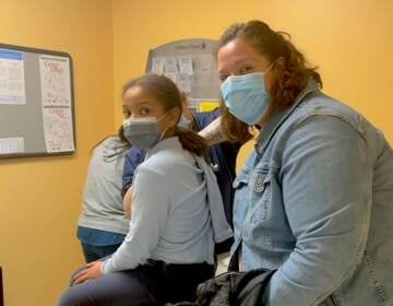 Olivia Jolley, 8, with her mother Jimena after getting the vaccine at Westside Family Healthcare in Wilmington. (Courtesy of Westside)