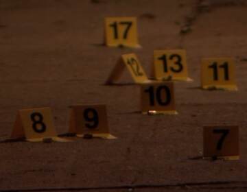 Evidence markers are pictured on a street.