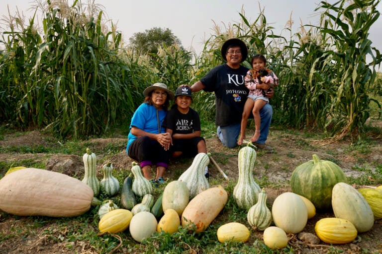 Native tribes have responded to the pandemic with creative ways to stay connected. Veronica Concho and Raymond Concho Jr. grew traditional Pueblo foods and Navajo crops with their grandchildren Kaleb and Kateri Allison-Burbank in Waterflow, N.M.
(Joshuaa Allison-Burbank/NPR)
