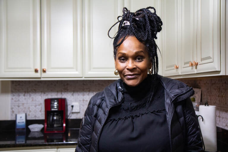 Sonja Bingham stands in her kitchen