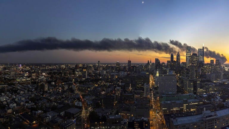 Plumes of smoke are seen stretching from Southwest Philly to South Jersey