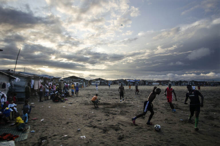 Thanksgiving is a day at the beach — quite literally — for young Liberians. Above, the beach in West Point is a sandy playing field for soccer lovers.
(Tommy Trenchard for NPR)