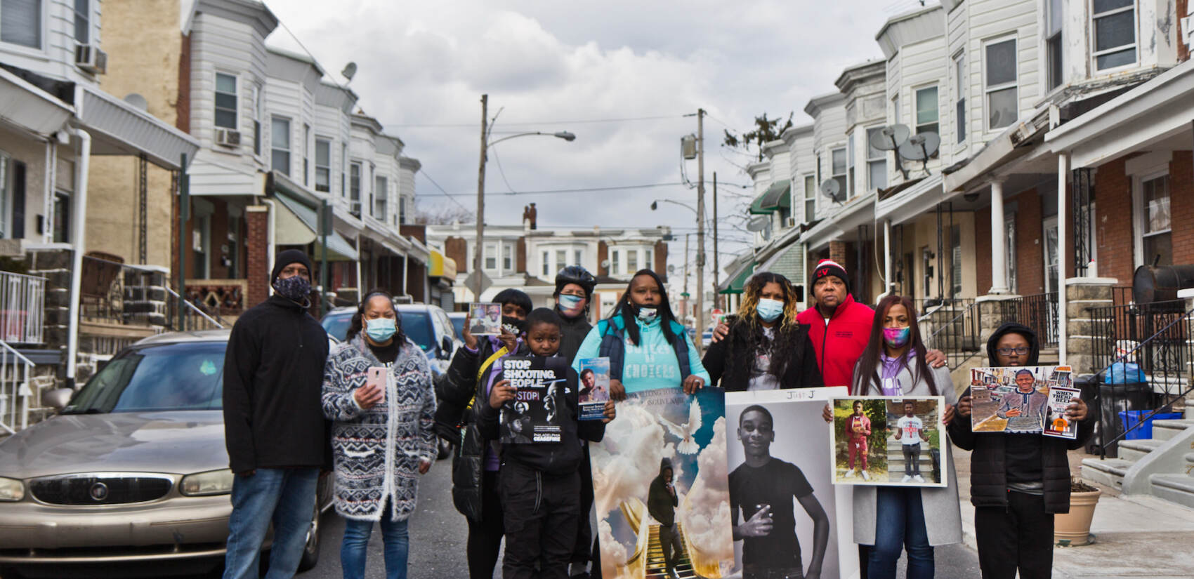 Members of the organization Voices by Choices held an event on the Simpson Street block where 7-year-old Zamar Jones was fatally shot in the summer of 2020 for those affected by gun violence on Martin Luther King Jr. Day. (Kimberly Paynter/WHYY)