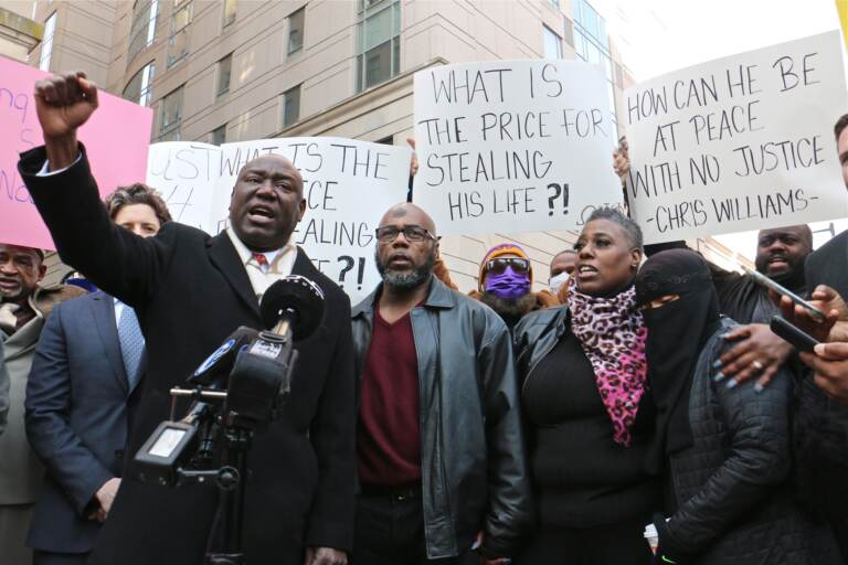 Chris Williams is accompanied by his attorney and supporters at a press confernece