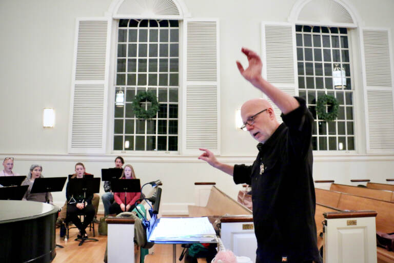 Conductor Donald Nally leads The Crossing choral ensemble during a rehearsal at the Presbyterian Church of Chestnut Hill. (EmmaLee/WHYY)