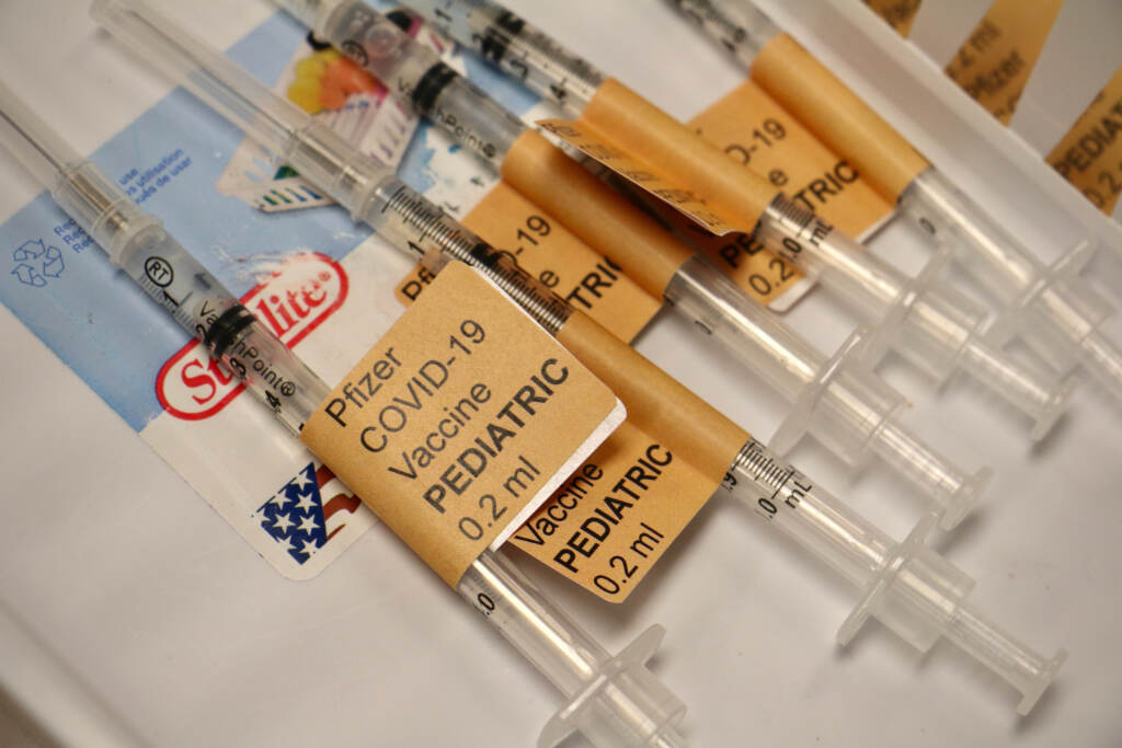 Pediatric doses of the Pfizer COVID-19 vaccine are prepared at the Jefferson COVID-19 mobile unit clinic at Universal Institute Charter School in South Philadelphia