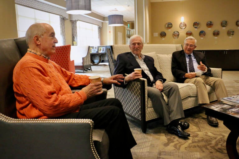 Ware Presbyterian Village residents (from left) Fred Crotchfelt, Jerry Dobbs and Ron Masters gather near the fireplace