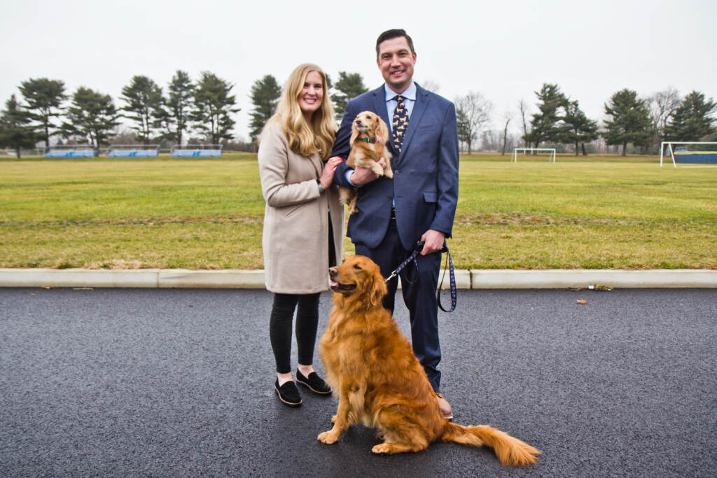 Dr. Matthew Edson with his wife Jenna and their two dogs