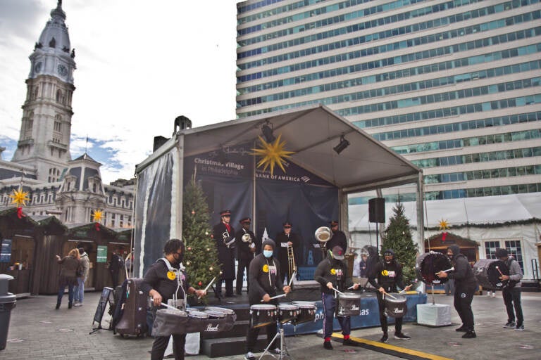 The Mad Beatz Philly drumline and the Salvation Army Brass Quartet kicked off Salvation Army Red Kettle Month at the LOVE Park Christmas Village on December 3, 2021. (Kimberly Paynter/WHYY)