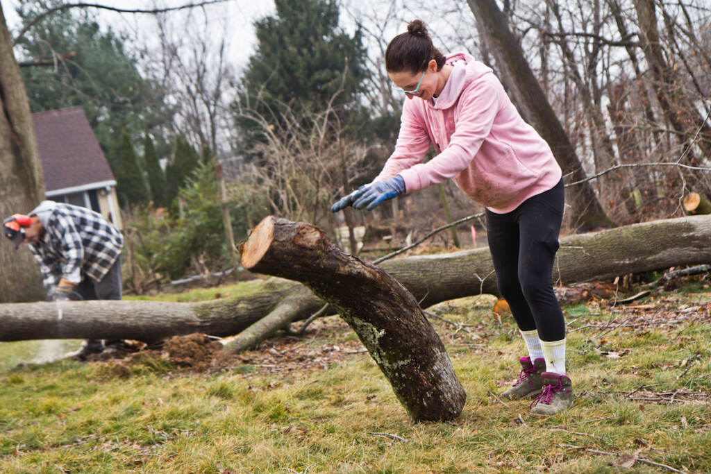 Rachel ''She-Hulk'' Bennett, an eighth grade teacher, rolls a log off the Warshawer property