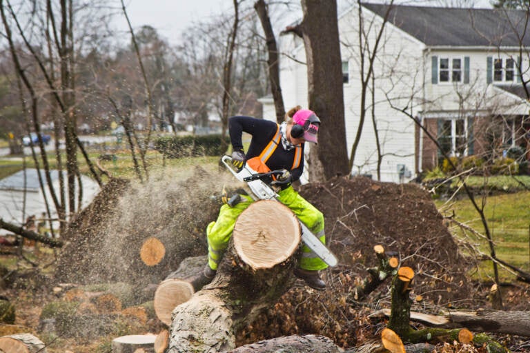 Elementary school teacher Nicki Besada, aka “Chainsaw Barbie”, is part of The Upper Darby Chainsaw Gang that’s working to clear debris since a tornado tore apart the area in September 2021