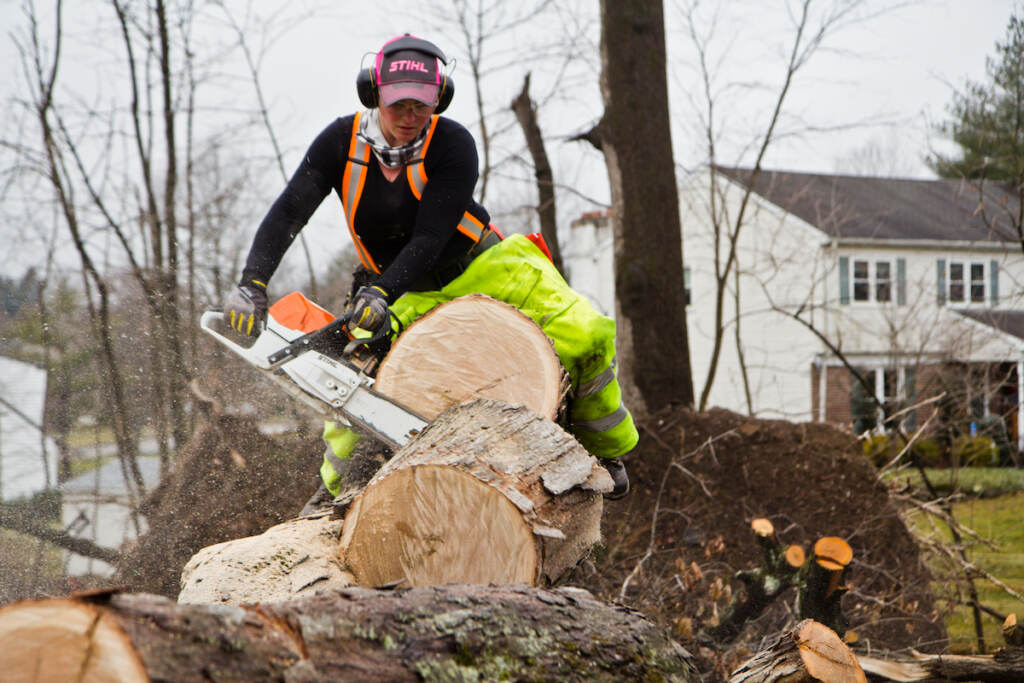 Elementary school teacher Nicki Besada, aka “Chainsaw Barbie”, is part of The Upper Dublin Chainsaw Gang that’s working to clear debris since a tornado tore apart the area in September 2021