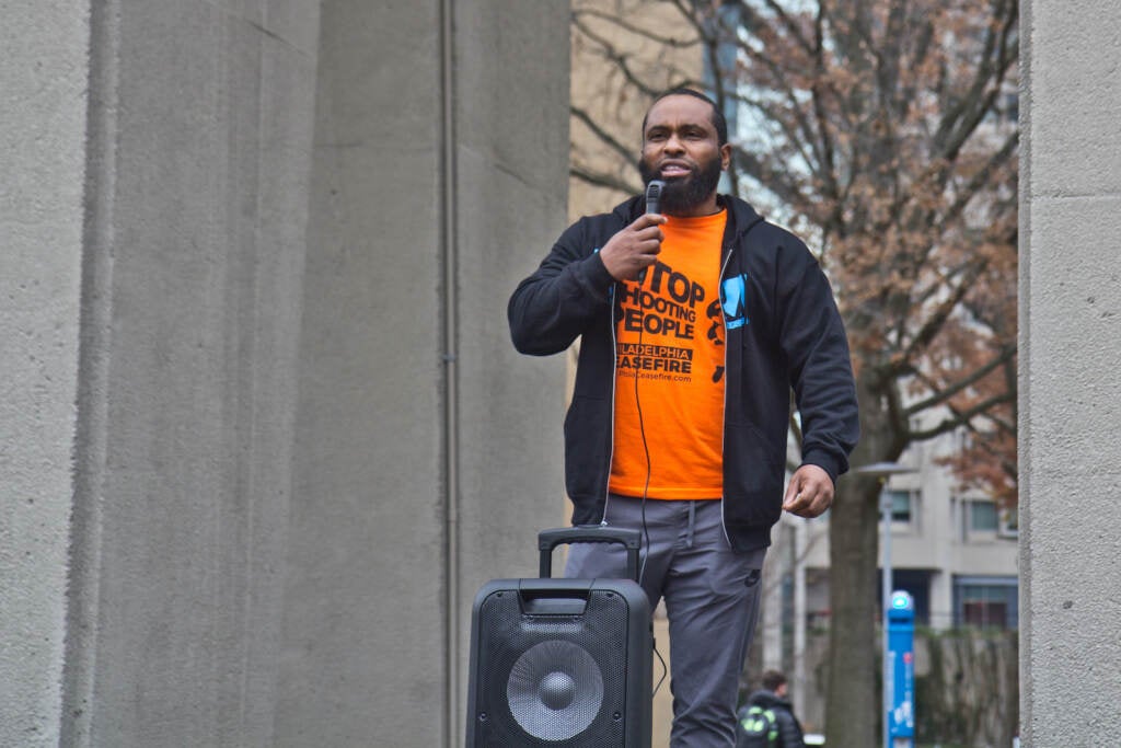 Raddee Hammet speaks to a crowd at an anti-violence rally