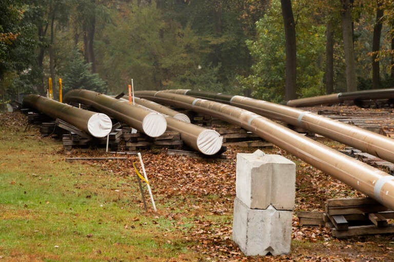 In this Oct. 22, 2019 file photo, pipes lay along a construction site on the Mariner East pipeline in a residential neighborhood in Exton, Pa