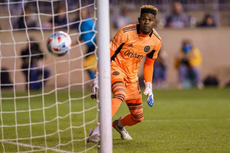 Philadelphia Union's Andre Blake watches as the show by Nashville SC's Hany Mukhtar goes in for a goal during the first half of an MLS playoff soccer match, Sunday, Nov. 28, 2021, in Chester, Pa. (AP Photo/Chris Szagola)