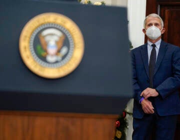 Dr. Anthony Fauci, director of the National Institute of Allergy listens as President Joe Biden speaks about the COVID-19 variant named omicron, in the Roosevelt Room of the White House, Monday, Nov. 29, 2021, in Washington. (AP Photo/Evan Vucci)