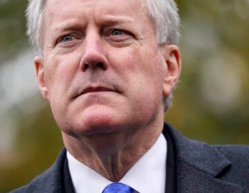 Then White House chief of staff Mark Meadows speaks with reporters outside the White House, Monday, Oct. 26, 2020, in Washington.