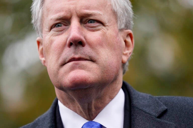 Then White House chief of staff Mark Meadows speaks with reporters outside the White House, Monday, Oct. 26, 2020, in Washington.