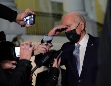 President Joe Biden talks with reporters at the White House in Washington, Friday, Dec. 3, 2021, as he prepares to leave for Camp David