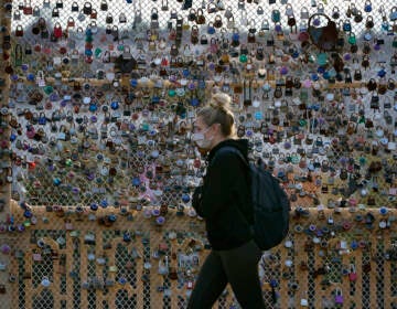 Locks cover the fence on the Love Bridge