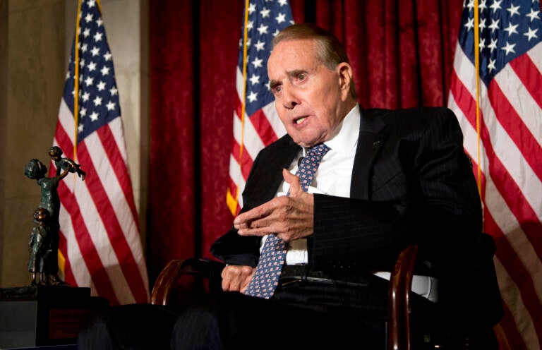 FILE - Former Senate Majority Leader Bob Dole, right, speaks after being presented with the McGovern-Dole Leadership Award by Vice President Joe Biden, to honor his leadership in the fight against hunger, during the 12th Annual George McGovern Leadership Award Ceremony hosted by World Food Program USA, on Capitol Hill in Washington, Wednesday, Dec. 11, 2013. Bob Dole, who overcame disabling war wounds to become a sharp-tongued Senate leader from Kansas, a Republican presidential candidate and then a symbol and celebrant of his dwindling generation of World War II veterans, has died. He was 98. His wife, Elizabeth Dole, posted the announcement Sunday, Dec. 5, 2021, on Twitter.  (AP Photo/Manuel Balce Ceneta, File)