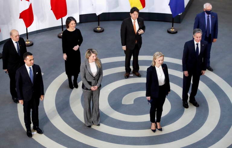 G7 foreign ministers, pose in a socially distanced manner for a group photo at the Museum of Liverpool, Liverpool, England, Saturday Dec. 11, 2021. Foreign Secretary Liz Truss is hosting U.S. Secretary of State Antony Blinken and other Group of Seven counterparts for weekend talks in the northwest England port city of Liverpool as the wealthy nations club faces growing tensions with Russia, China and Iran. From left, France's Minister for Europe and Foreign Affairs Jean-Yves Le Drian, Italy's Foreign Minister Luigi Di Maio, Germany's Foreign Minister Annalena Baerbock, Canada's Minister of Foreign Affairs Melanie Joly, Japan's Foreign Minister Yoshimasa Hayashi, Britain's Foreign Secretary Liz Truss, US Secretary of State Antony Blinken and European High Representative of the Union for Foreign Affairs Josep Borrell