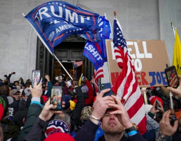 File photo: Insurrections loyal to President Donald Trump riot outside the Capitol, Jan. 6, 2021, in Washington. For many rioters who stormed the U.S. Capitol, self-incriminating messages, photos and videos that they broadcast on social media before, during and after the Jan. 6 insurrection are influencing even the sentences in their criminal cases. Among the biggest takeaways from the Justice Department’s prosecution of the Jan. 6 insurrection is how large a role social media has played, with much of the most damning evidence coming from rioters own words and videos