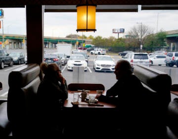Customers sit in a booth at the Penrose Diner