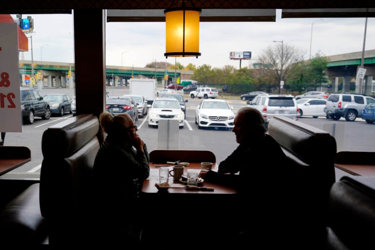 Customers sit in a booth at the Penrose Diner