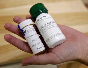 FILE - This Sept. 22, 2010 file photo shows bottles of abortion pills at a clinic in Des Moines, Iowa. The Food and Drug Administration on Thursday, Dec. 16, 2021 loosened some restrictions on the pill mifepristone, allowing it to be dispensed by more pharmacies. (AP Photo/Charlie Neibergall, file)