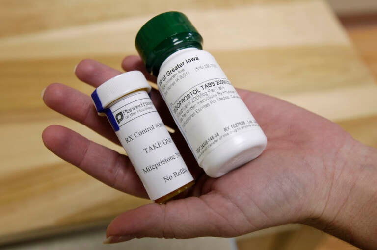 FILE - This Sept. 22, 2010 file photo shows bottles of abortion pills at a clinic in Des Moines, Iowa. The Food and Drug Administration on Thursday, Dec. 16, 2021 loosened some restrictions on the pill mifepristone, allowing it to be dispensed by more pharmacies. (AP Photo/Charlie Neibergall, file)