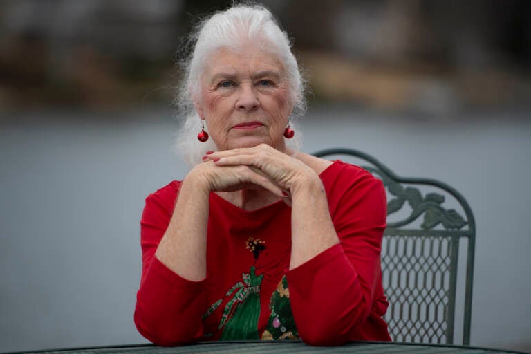 Wanda Olson poses for a photo, Friday, Dec. 17, 2021, in Villa Rica, Ga. When Olson’s son-in-law died in March after contracting COVID-19, she and her daughter had to grapple with more than just their sudden grief. They had to come up with money for a cremation. Even without a funeral, the bill came to nearly $2,000, a hefty sum that Olson initially covered. (AP Photo/Mike Stewart)