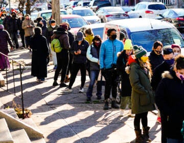 City residents wait in a line extending around the block