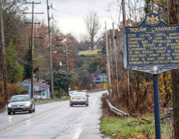 In this photo from Thursday, Nov. 18, 2021, a Pennsylvania Historical and Museum Commission plaque is seen along a roadside in New Castle, Pa. A recent review of all 2,500 markers the Pennsylvania Historical and Museum Commission had been installing for more than a century, faced a fresh round of questions about just whose stories were being told on the state's roadsides, and the language used to tell them. The increased scrutiny that has focused on factual errors, inadequate historical context and racist or otherwise inappropriate references, prompting the state to remove two markers, revise two and order new text for two others so far. The changes have become grist for the political mill. (AP Photo/Keith Srakocic)