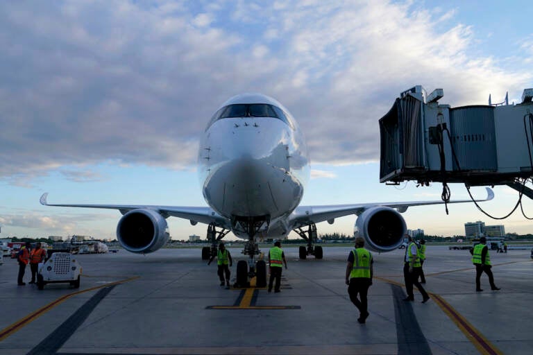 A Lufthansa flight arrives from Munich, Germany at Miami International Airport, Monday, Nov. 8, 2021, in Miami. Beginning Monday, bans on travel from specific countries are over. The U.S. will allow in international travelers, but they must be vaccinated — with a few exceptions