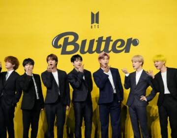 Members of South Korean K-pop band BTS, V, SUGA, JIN, Jung Kook, RM, Jimin, and j-hope from left to right, pose for photographers ahead of a press conference to introduce their new single 