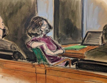 In this courtroom sketch, Ghislaine Maxwell, center, sits in the courtroom during a discussion about a note from the jury, during her sex trafficking trial, Wednesday, Dec. 29, 2021, in New York