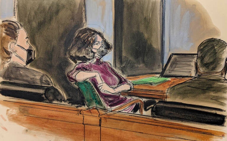 In this courtroom sketch, Ghislaine Maxwell, center, sits in the courtroom during a discussion about a note from the jury, during her sex trafficking trial, Wednesday, Dec. 29, 2021, in New York