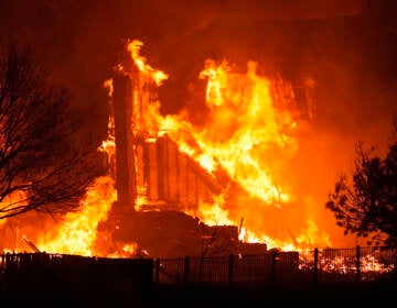 Homes burn as wildfires rip through a development near Rock Creek Village Thursday, Dec. 30, 2021, near Broomfield, Colo. Homes surrounding the Flatiron Crossing mall were being evacuated as wildfires raced through the grasslands as high winds raked the intermountain West