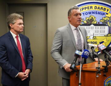 Delaware County District Attorney Jack Stollsteimer (L) and Upper Darby Police Superintendent Tomothy Bernhardt (R) announce charges following the shootout at the 69th Street Transportation Center. (Kenny Cooper/WHYY)