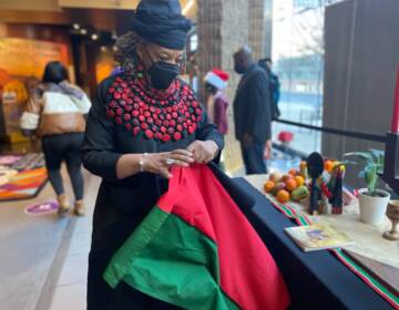 Maisha Ogonza at the first day of the African American Museum in Philadelphia’s Kwanzaa celebration. (Tennyson Donyéa, WHYY)