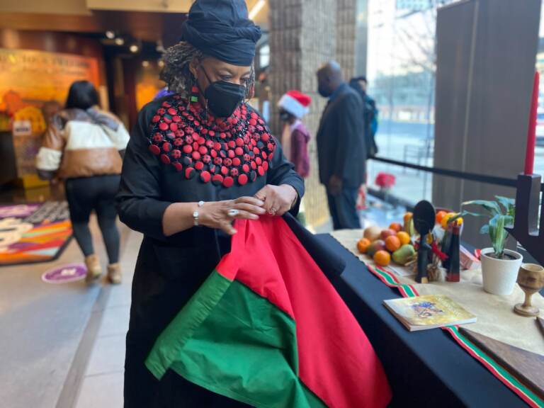 Maisha Ogonza at the first day of the African American Museum in Philadelphia’s Kwanzaa celebration. (Tennyson Donyéa, WHYY)