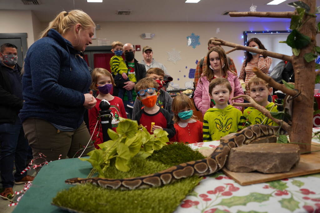 Laura Soder, the zoo's manager of ambassador animal engagement, introduces Monty to a group of kids