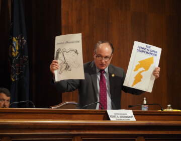 House GOP Leader Kerry Benninghoff holds up an image of a district he thinks is unacceptably gerrymandered