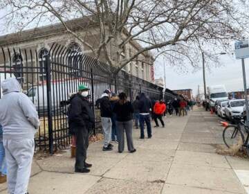 The line outside the Lillian Lillian Marrero Library stretched around three sides of a full city block. (Liz Tung/WHYY)