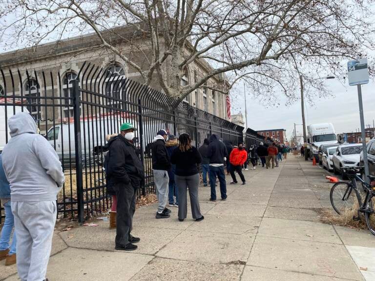 The line outside the Lillian Lillian Marrero Library stretched around three sides of a full city block. (Liz Tung/WHYY)