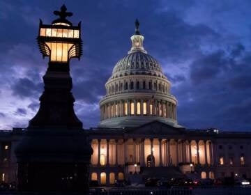 Night falls at the the Capitol in Washington, Thursday, Dec. 2, 2021, with the deadline to fund the government approaching. Republicans in the Senate are poised to stall a must-pass funding bill as they force a debate on rolling back the Biden administration's COVID-19 vaccine mandates for some workers