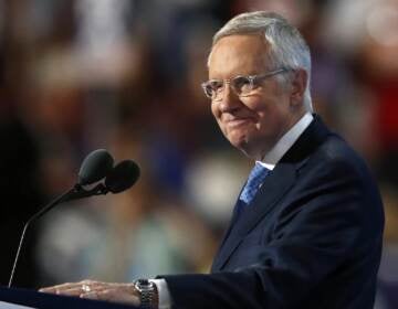 Senate Minority Leader Harry Reid of Nev., smiles from the podium as he speaks during the third day of the Democratic National Convention in Philadelphia on July 27, 2016. (Paul Sancya/AP)