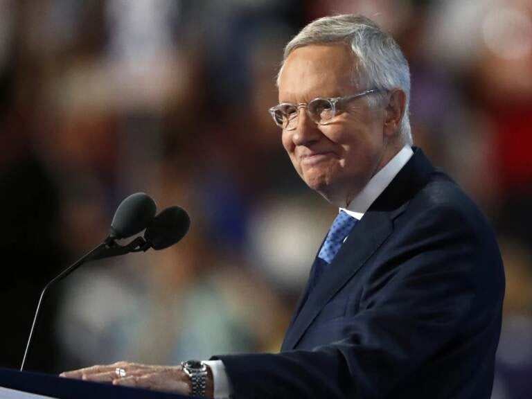 Senate Minority Leader Harry Reid of Nev., smiles from the podium as he speaks during the third day of the Democratic National Convention in Philadelphia on July 27, 2016. (Paul Sancya/AP)